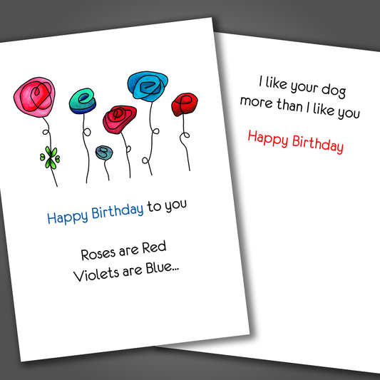 Funny happy birthday card with red and blue flowers on the front of the card. Inside of the card is a funny joke that says I like your dog more than you.