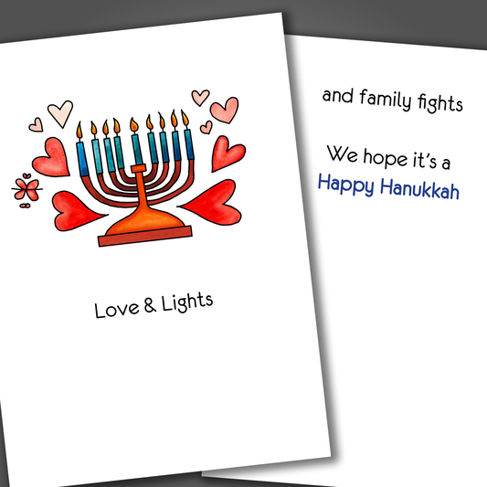 Happy Hanukkah card with a minora drawn on the front of the card with the phrase love and lights. Inside the card is the phrase and family fights! Happy Hanukkah!