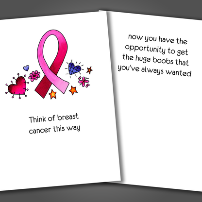 Breast cancer support card with a pink ribbon and heart drawn on the front of the card. Inside the card is a funny joke that says now you can get the huge boobs you always wanted.