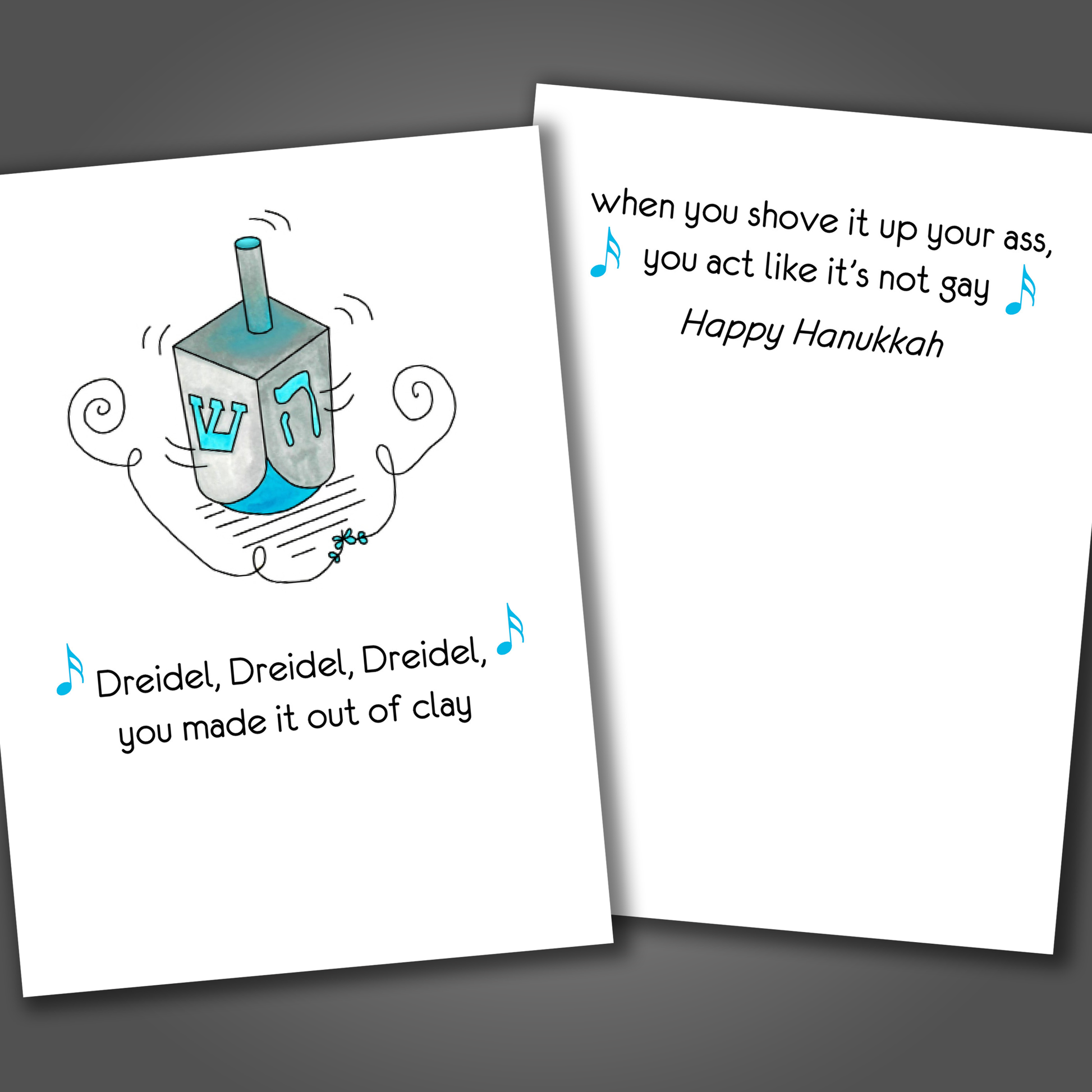 Funny Hanukkah card with a dreidel drawn on the front of the card. Inside the card is a funny joke that says when you shove it up your ass you act like it's not gay!