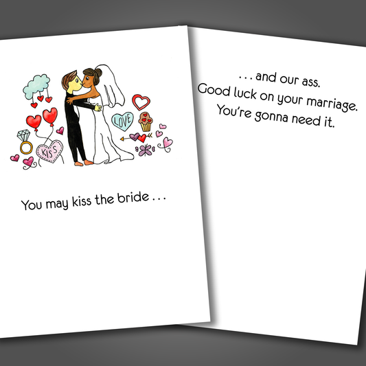 Funny wedding congratulations card with a drawing of a bride and groom kissing on the front of the card. Inside the card is a funny joke that says kiss our ass. Good luck on your marriage!